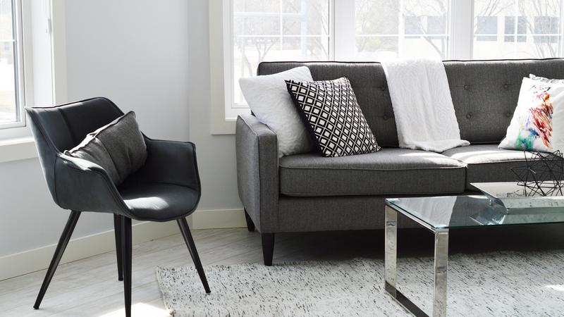 Upholstery steam cleaning lifting stains from a fabric lounge